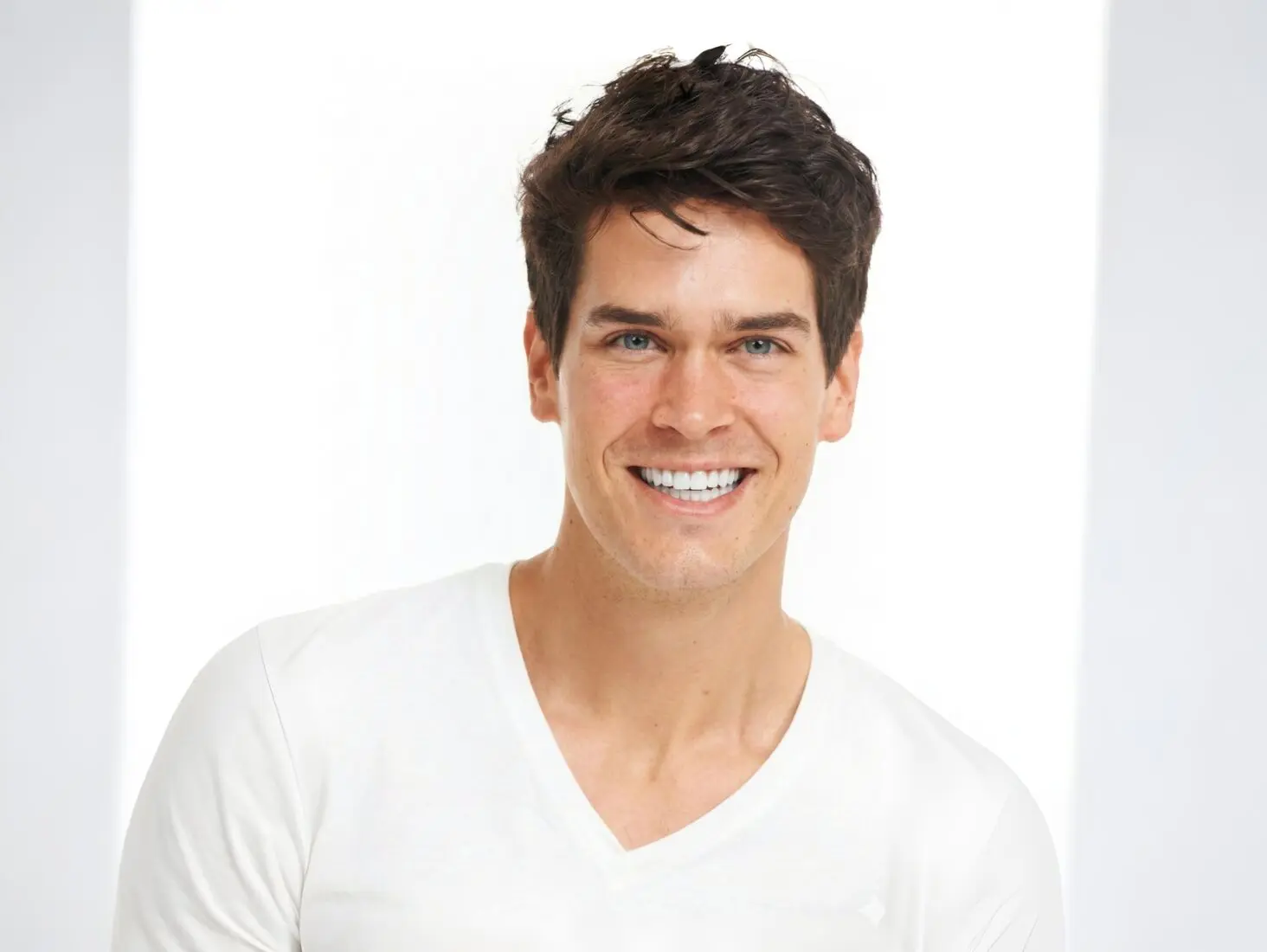 A smiling man on a white background